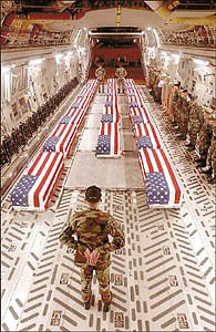 The coffins of soldiers killed in Iraq and Afghanistan being unloaded at Dover (Del.) Air Force Base. The Bush Administration banned news organizations from taking photos of military caskets, but this and 287 other photos taken by the U.S. Air Force were released through a Freedom of Information Act request.